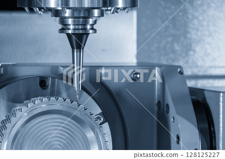 The 5-axis CNC milling machine cutting the gear part with solid ball nose end mill tools in the light blue scene. 128125227