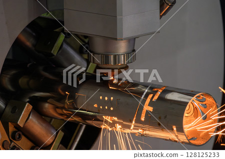 Close up scene the fiber laser cutting machine cut the stainless steel tube control by CNC program. Close up scene the fiber laser cutting machine cut the stainless steel tube control by CNC program. 128125233
