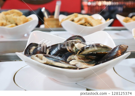 sea mussel or mussel on the dish for cook 128125374