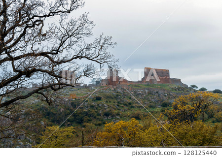 Beautiful view of ancient ruins Hammershus in cloudy weather on the island Bornholm, Denmark Beautiful view of ancient ruins Hammershus in cloudy weather on the island Bornholm, Denmark 128125440