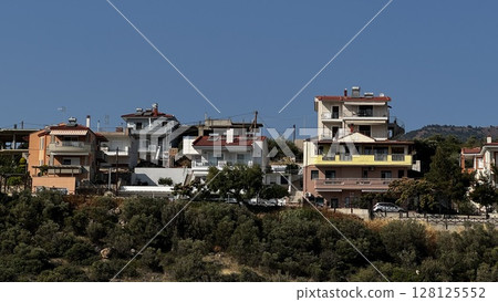 Traditional Greek Homes on Elevated Hillside Traditional Greek Homes on Elevated Hillside 128125552