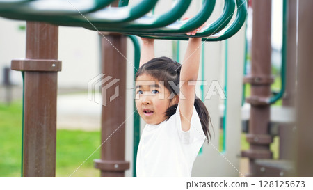 Girls playing in the clouds in the park Girls playing in the clouds in the park 128125673