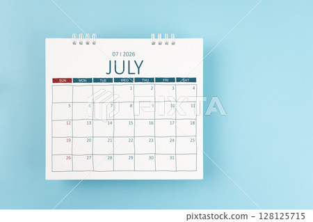 July 2026 Monthly desk calendar for 2026 year on blue color background. Flat lay. July 2026 Monthly desk calendar for 2026 year on blue color background. Flat lay. 128125715