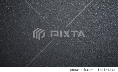 Charcoal grey industrial background with scattered noise particles 128125858
