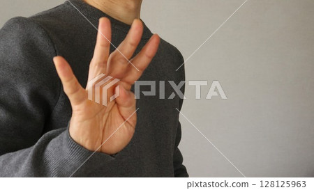 Close-up of a posing Japanese man 128125963
