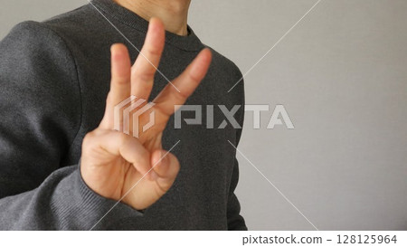 Close-up of a posing Japanese man 128125964