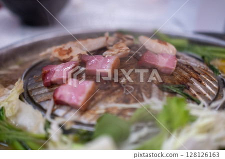 Thai style pork, bacon and seafood barbecue with vegetable soup Thai style pork, bacon and seafood barbecue with vegetable soup 128126163