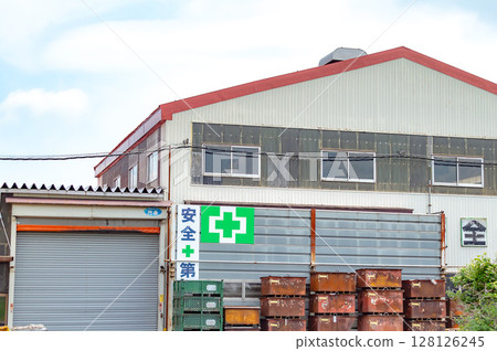 Factory with white exterior and blue sky 128126245