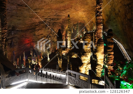 Zhangjiajie, Hunan Province, China - March 12, 2025: The beautiful interior of the Huanglong Cave in Zhangjiajie.ean landscapes within the cave. 128126347