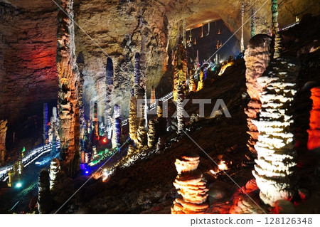 Zhangjiajie, Hunan Province, China - March 12, 2025: The beautiful interior of the Huanglong Cave in Zhangjiajie.ean landscapes within the cave. 128126348