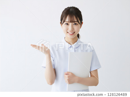 Smiling and friendly portrait of a nurse 128126489