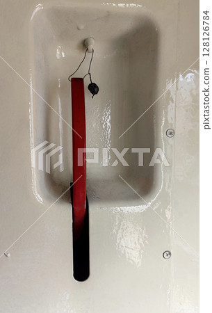 emergency brake mechanism in train carriage system for safety during operation and travel. closeup. emergency brake mechanism in train carriage system for safety during operation and travel. closeup. 128126784