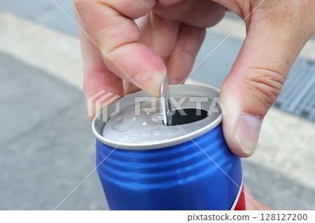 Male hand opening a can of drink 1 Male hand opening a can of drink 1 128127200