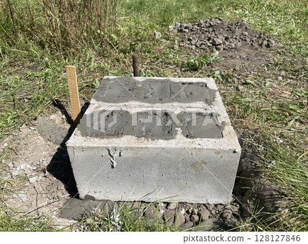Foundation made of concrete cinder blocks Foundation made of concrete cinder blocks 128127846