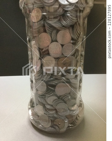 Money images: lots of gold coins 128127895