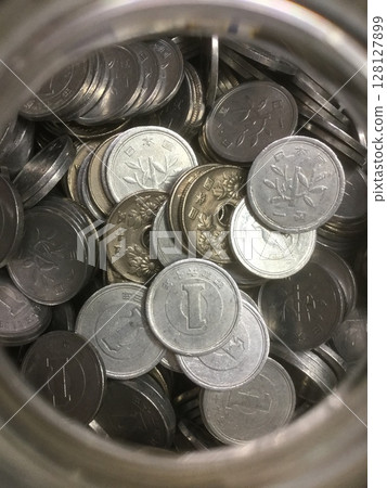 Money image: Tin of coins 128127899
