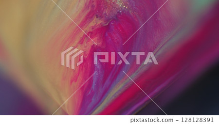 Flowing liquid. Shimmer ink. Defocused pink purple yellow colorful splash water particles sparkling texture on abstract background. 128128391