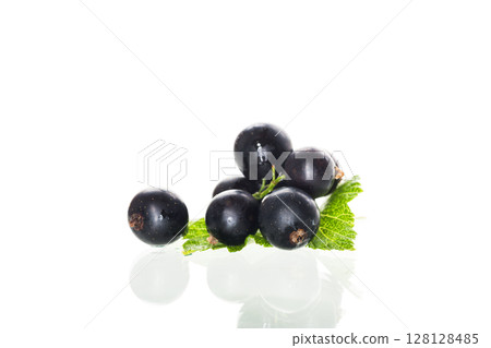 some blackcurrant berries isolated on white background some blackcurrant berries isolated on white background 128128485