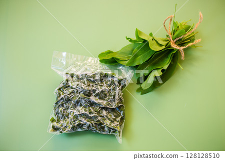 Fresh and frozen sorrel on a green background 128128510