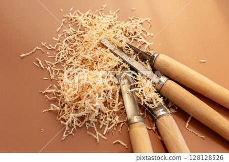 Carpentry tool set with wood shavings Carpentry tool set with wood shavings 128128526