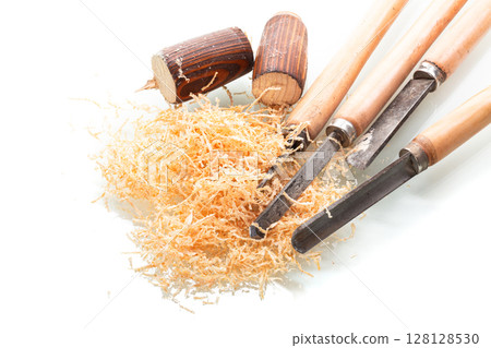 Chisel and wood in process on white background Chisel and wood in process on white background 128128530