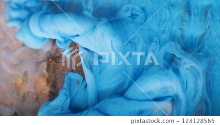 Underwater fume. Ink background. Blur blue color smog twirling pigment particles spreading on acrylic wooden bark art abstraction. 128128565