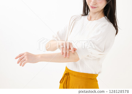 Woman doing body care 128128578