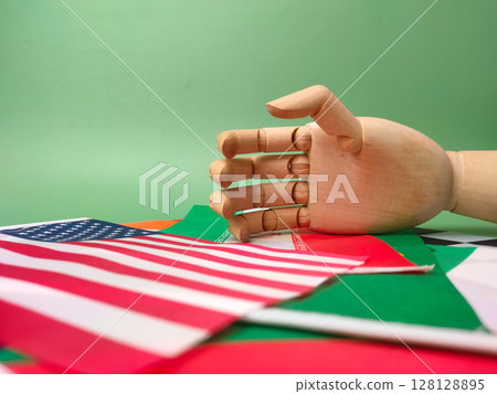 Hand shake with world wide flag country on a greem background. Geopolitical concept. 128128895