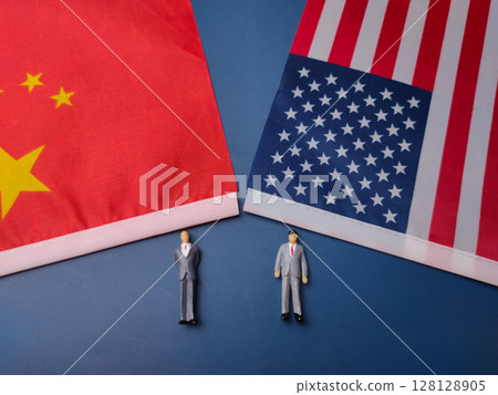 China and us flag with miniature people on a blue background. China and us flag with miniature people on a blue background. 128128905