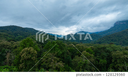 Aerial view of Cloud-Covered Mountain Peak Aerial view of Cloud-Covered Mountain Peak 128129360