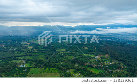 Aerial view of Cloud-Covered Mountain Peak 128129361