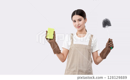 Young cleaning lady isolated on white background holding sponge and yarrow for cleaning 128129889