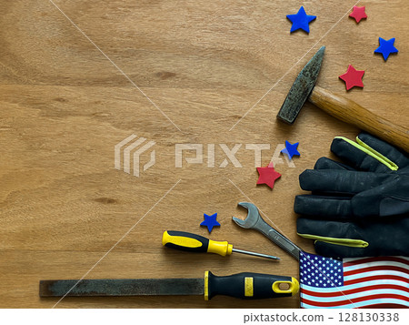 A mixed background for American Labor Day featuring tools like a hammer, wrench, screwdriver, and gloves, A mixed background for American Labor Day featuring tools like a hammer, wrench, screwdriver, and gloves, 128130338