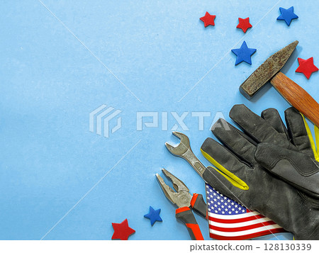 A mixed background for Labor Day in America. Tools like pliers, wrench, hammer, A mixed background for Labor Day in America. Tools like pliers, wrench, hammer, 128130339