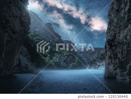 Milky Way over the beautiful mountain canyon and sea at night 128130440