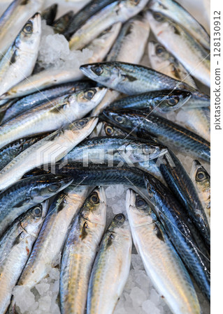 Chub mackerel or Scomber japonicus fishes in box at Greek fish market. Vertical. 128130912