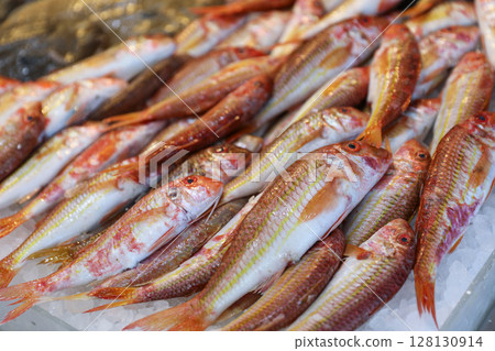 Red striped mullet fishes or Mullus surmuletus on ice in Greek fish market. Horizontal. 128130914