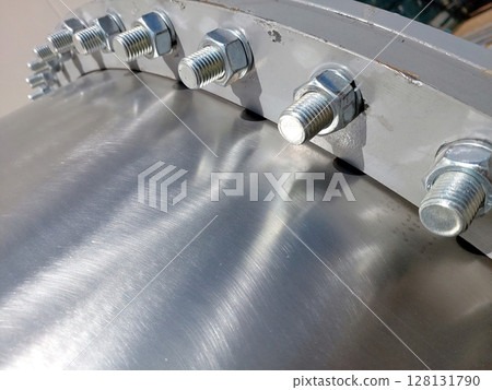 Flange Assembly With Bolts and Nuts Used in Mechanical Applications and Manufacturing Settings Flange Assembly With Bolts and Nuts Used in Mechanical Applications and Manufacturing Settings 128131790