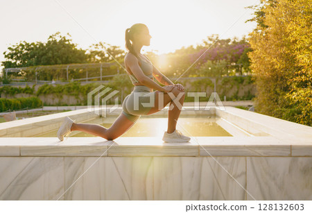 Revitalizing Sunset Yoga Stretch in Nature A Unique Fitness Lifestyle Experience 128132603