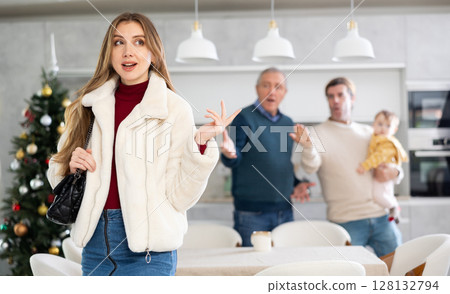 Two men quarreling with young woman 128132794
