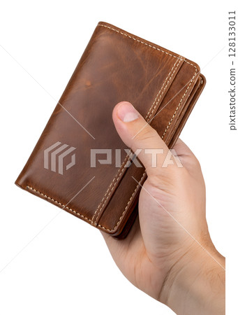 Hand holding brown leather wallet isolated on transparent background, minimalist design, money holder, bifold style, fashion accessory, finance concept 128133011