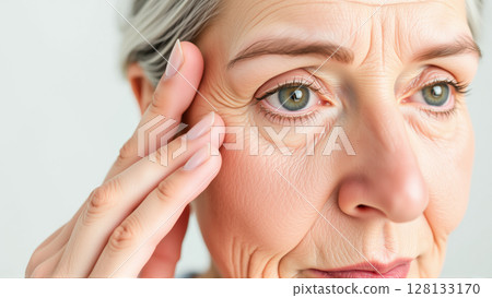 Portrait of a middle-aged woman. Facial wrinkles are pronounced 128133170