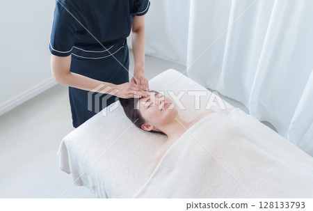 A woman attending a beauty salon A woman attending a beauty salon 128133793