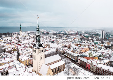 Aerial View of Tallinn in winter, roofs are covered with snow, Christmas mood 128134967