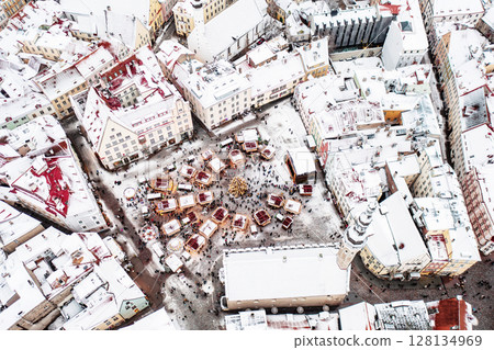 Aerial View of Tallinn with the Town Hall Square in winter, roofs with snow, Christmas mood Aerial View of Tallinn with the Town Hall Square in winter, roofs with snow, Christmas mood 128134969