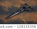 Vintage embroidery scissors on rusty background 128135356