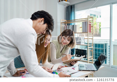 Creative Team collaboration on UX UI Design Project in Modern Office Environment with Digital Devices and Design Tools 128135778