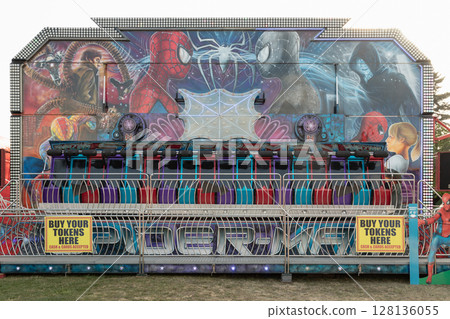 the Miami Trip or Miami Wave, Riders sit in a row of seats that move in a vertical circle. the Miami Trip or Miami Wave, Riders sit in a row of seats that move in a vertical circle. 128136055