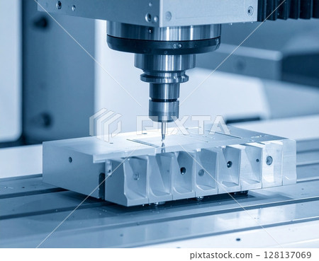 CNC milling machine processing on steel with cooling 128137069