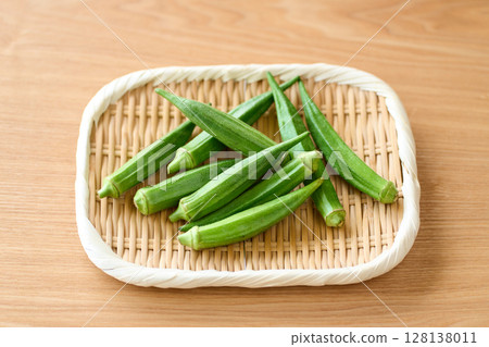 Domestic okra served in a colander 128138011